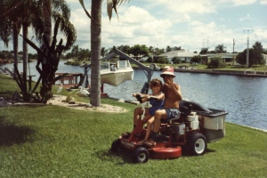 One of dozens of pictures of Heather riding the lawnmower with her Pop-pop at his home in Port Charlotte, FL